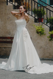 Strapless Satin Wedding Dress with Draped Bodice and Floral Accent