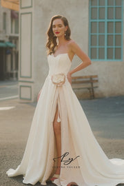 Elegant Strapless Satin Wedding Dress with Floral Accent
