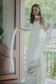 Elegant Pleated Strapless Wedding Gown with Chiffon Drape
